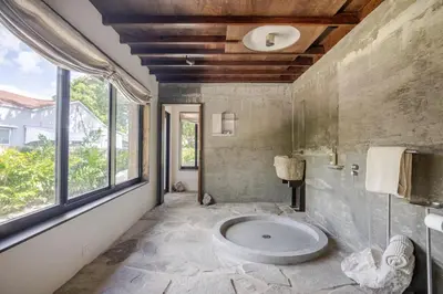 a bathroom with a large sink in a room with a window at Casa Kawa lumicollection in Miami