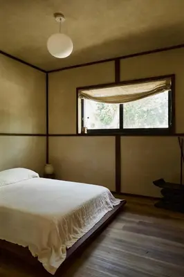 a bedroom with a large bed and a window at Casa Kawa lumicollection in Miami
