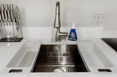 a sink in a kitchen with a stainless steel sink at Elite Brickell Studio on the Bay in Miami