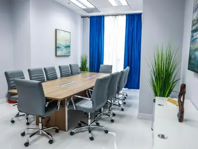 a conference room with a wooden table and chairs at Elite Brickell Studio on the Bay in Miami