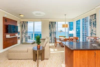 a living room with a couch and a table at Trump International Beach Resort Ocean View 1100 sf 1 Bed 1Bth Privately Owned Sunny Isles in Miami Beach