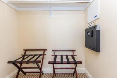 two wooden stools sitting next to a wall with a microwave at Trump International Beach Resort Ocean View 1100 sf 1 Bed 1Bth Privately Owned Sunny Isles in Miami Beach