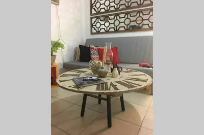 a living room with a table and a couch at 1 Bedroom Apt near Coconut Grove in Miami