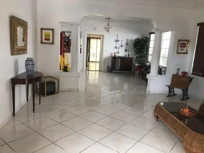 a living room with a large tile floor at Cozy Room in the Heart of Little Havana in Miami