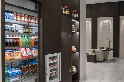 a store with a refrigerator with drinks in it at AC Hotel by Marriott Miami Dadeland in Miami