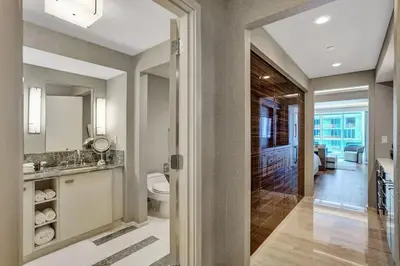 a bathroom with a sink and a toilet in a room at Coastal studio w hot tub gym access in Fort Lauderdale