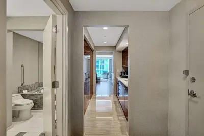 a bathroom with a toilet and a sink at Coastal studio w hot tub gym access in Fort Lauderdale