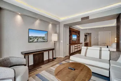 a living room with a couch and a table at Coastal studio w hot tub gym access in Fort Lauderdale