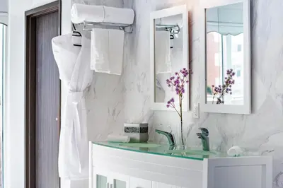 a bathroom with a sink and a mirror at Secret Garden Miami Beach in Miami Beach