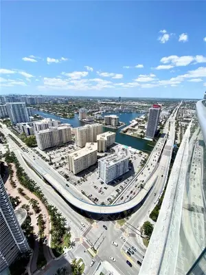an aerial view of a city with a freeway at Ocean view 1 bed- Steps from the beach! in Hallandale Beach