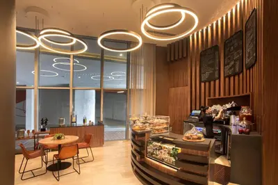 a restaurant with a counter and a table and chairs at Ocean view 1 bed- Steps from the beach! in Hallandale Beach