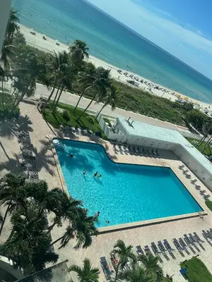 an overhead view of a swimming pool next to the beach at Casablanca on the beach in Miami Beach