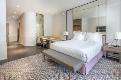 a large bedroom with a large bed and a table at Aluna Lux Suites at SLS Lux Brickell Building in Miami