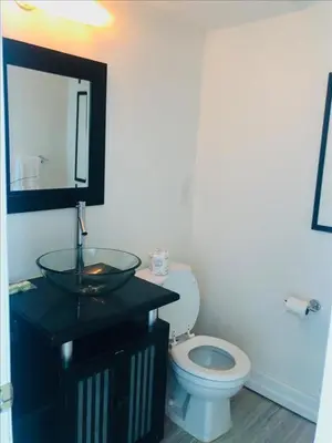 a bathroom with a sink and a toilet at Penthouse in the sky in Miami Beach