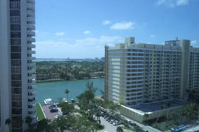 a view of a large building next to a river at Penthouse in the sky in Miami Beach