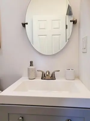 a bathroom with a sink and a mirror at Stylish & Newly-Renovated Suites near Las Olas in Fort Lauderdale