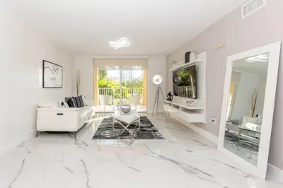 a white living room with a white couch and a mirror at Yacht Club at Aventura Lux 2 Bed 2 Bath Brand New 2021 in Aventura