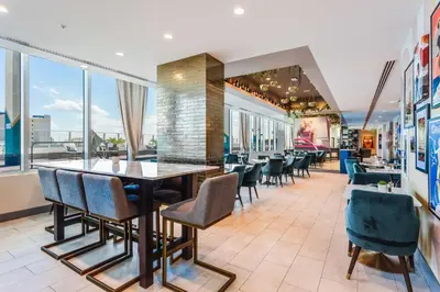 a dining room with a table and chairs at SERENA Hotel Aventura Miami, Tapestry Collection by Hilton in Aventura