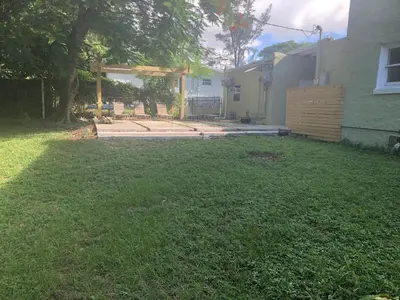 a yard of a house with a yard sidx sidx sidx at Airstream in the Center of it All in Miami