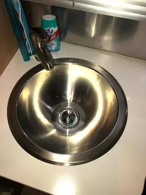 a stainless steel sink with a faucet on a counter at Airstream in the Center of it All in Miami