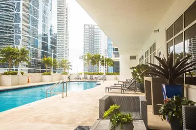 a swimming pool in a building with tall buildings at Modern and Luxurious Brickell Studio in Miami