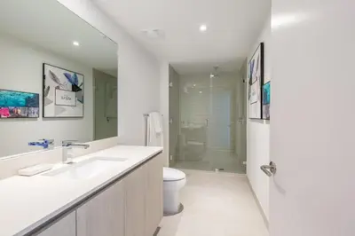 a bathroom with a sink and a toilet and a shower at Hyde Beach House Luxury Condo-Resort condo in Hollywood Beach
