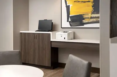 a desk with a laptop computer on top of it at Residence Inn Doral Mall Area in Doral