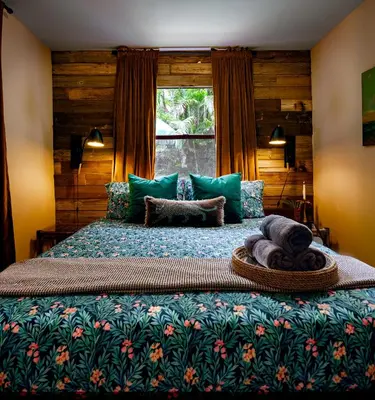 a bedroom with a large bed with a window at The Rum Locker - 1 King - 2 Twins - Private home and Patio - Sleeps 4 in Fort Lauderdale