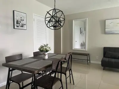 a dining room with a table and chairs at Spacious 1BR on the Beach, The Tides, Hollywood,FL in Hollywood