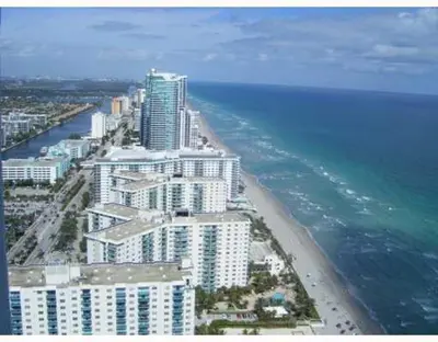 an aerial view of a beach with buildings and the ocean at Spacious 1BR on the Beach, The Tides, Hollywood,FL in Hollywood