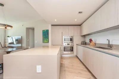 a kitchen with white cabinets and a counter top at Hyde Beach Luxury Condo-Resort condo in Hollywood Beach