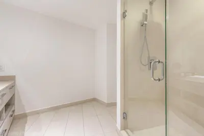 a bathroom with a shower with a glass door at Hyde Beach Luxury Condo-Resort condo in Hollywood Beach