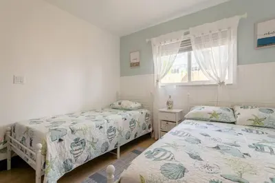 a bedroom with two beds and a window at Casa Madeira 2@ the heart of Miami Design District in Miami