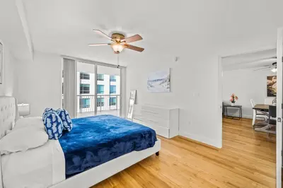 a bedroom with a bed and a ceiling fan at Luxury 1 Bedroom Apartment • Brickell • City and Ocean View in Miami