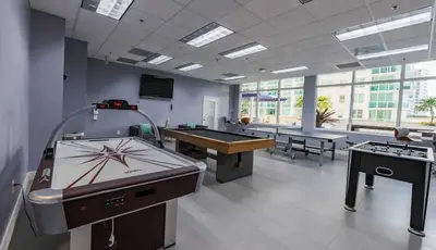 a large room with a ping pong table and a pool table at Luxury 1 Bedroom Apartment • Brickell • City and Ocean View in Miami