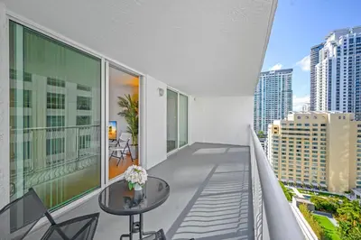 a balcony with a table and a view of a city at Luxurious 1 Bed Apartment • Brickell • Ocean Views in Miami