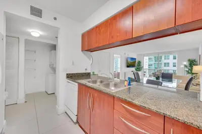 a kitchen with a sink and a counter top at Luxury 1 Bedroom Apartment • Brickell • Unique Views in Miami