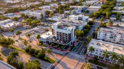 an aerial view of a city with palm trees and buildings at Upsun Hotel in Miami Beach