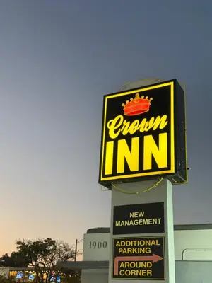 a sign for a crown inn on top of a building at Crown Inn in Fort Lauderdale