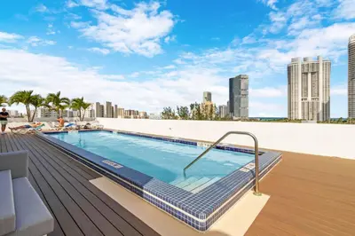 a swimming pool on the roof of a building at Roami at Sunny Isles in Miami Beach