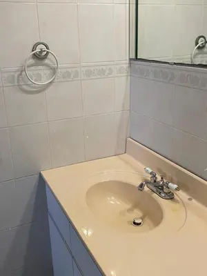 a bathroom with a sink and a mirror at Private Cubicle - Single Bed - Mixed Shared Dorm - MIAMI AIRPORT in Miami