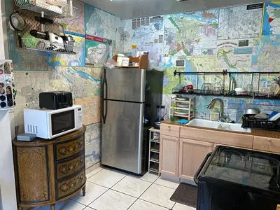 a kitchen with a refrigerator and a microwave at Private Cubicle - Single Bed - Mixed Shared Dorm - MIAMI AIRPORT in Miami