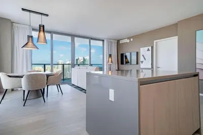 a kitchen and dining room with a table and chairs at Hyde Beach House Luxury Condo-Resort condo in Hollywood Beach