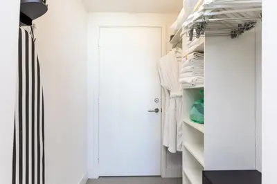 a walk in closet with white doors and shelves at HYDEOV1BR - Unit 1910 - Ammos condo in Hollywood Beach