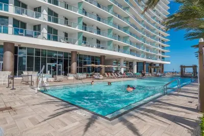 a swimming pool in front of a hotel at HYDEOV1BR - Unit 1910 - Ammos condo in Hollywood Beach