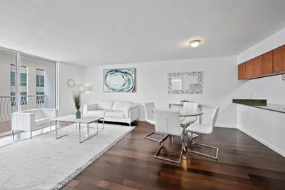 a living room with white furniture and a table at Private Unit Miami With Amenities And Parking in Miami
