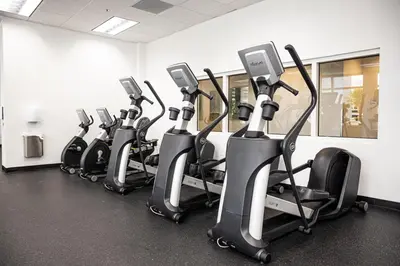 a row of exercise bikes in a gym at High Rise Brickell Modern Studio in Miami