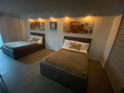 a bedroom with two beds and a bedskirts at High Rise Brickell Modern Studio in Miami