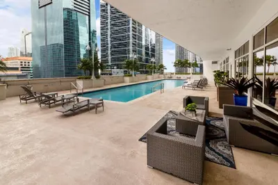 a swimming pool on the roof of a building at High Rise Brickell Modern Studio in Miami