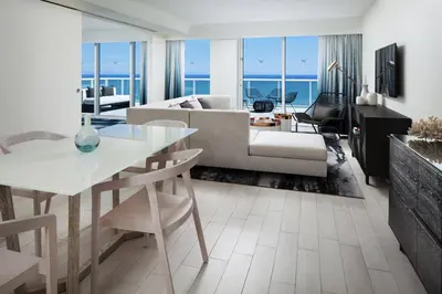 a living room with a couch and a table at W Fort Lauderdale in Fort Lauderdale